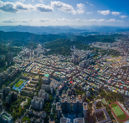 Aerial panorama over the highrise housing, skyscrapers and crowded cityscape of central Taipei, Taiwan’s vibrant capital city.