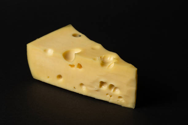 istock Piece of cheese isolated on a black