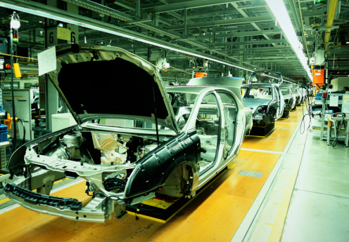 unfinished automobiles in a car plant