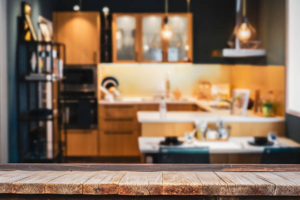istock Wood table with blur kitchen room background .For montage product display or design key visual layout. 1198089642