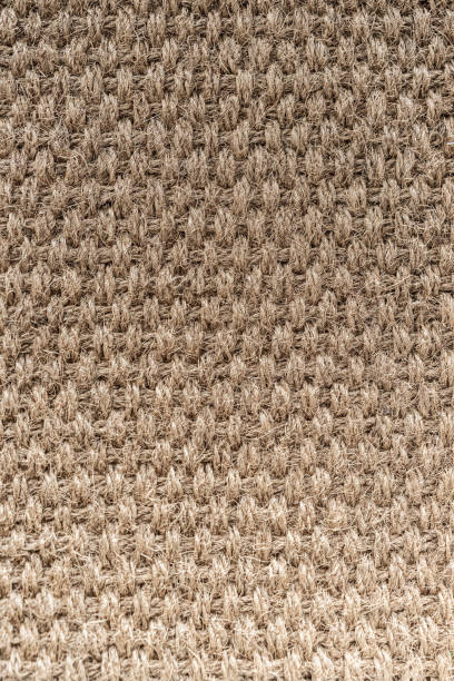 istock beige or straw colored wicker or seagrass, traditional weave rattan texture background. 1198089656
