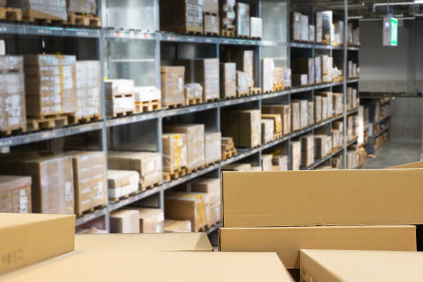 istock Stack of cardboard boxes in smart warehouse industry logistic. 1198089697