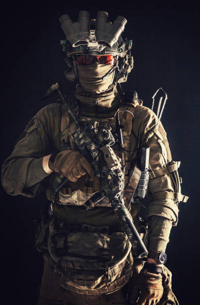 istock Anti-terrorist squad equipped fighter soldier in darkness 1198089936