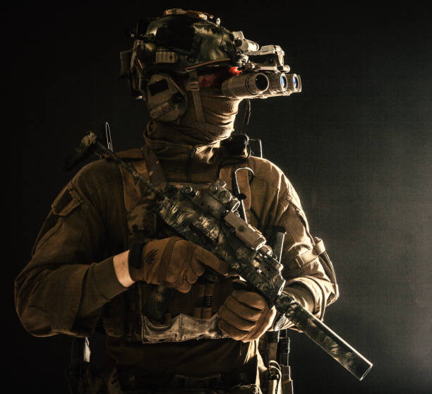 istock Army special forces tactical group fighter in dark 1198089970