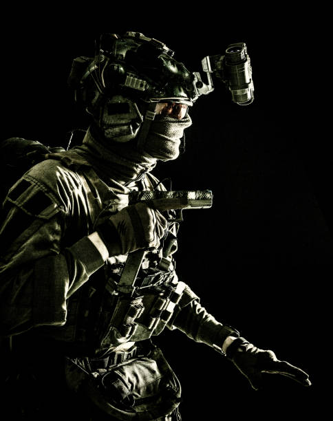istock Military security service fighter sneaking in dark 1198090221
