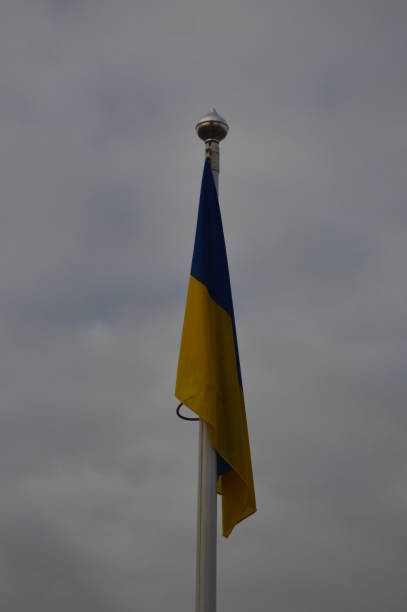 istock Ukraine flag hanging on a flagpole without the wind 1198092586