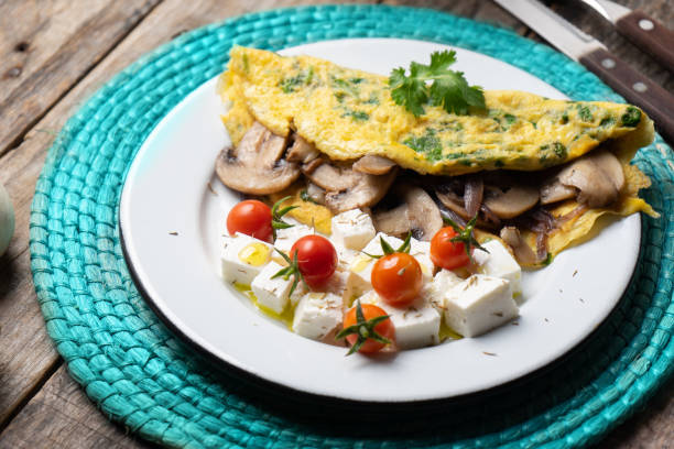 istock Mushroom omelette with fresh cheese and cherry tomatoes 1198103812