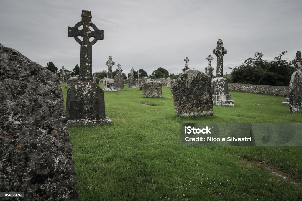 Irish graveyard on an abandond spot Beautiful scenery on a spooky and mystical graveyard Castle Stock Photo