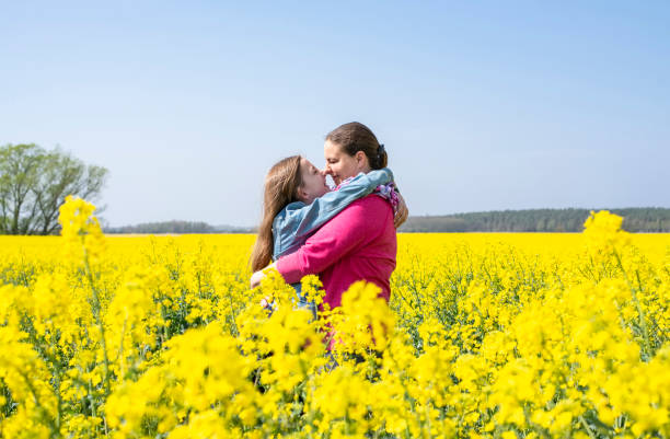 istock mother and daughter in rape field 1198105663