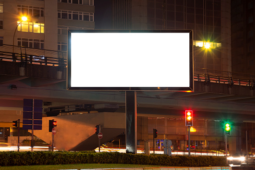 Blank billboard on night street