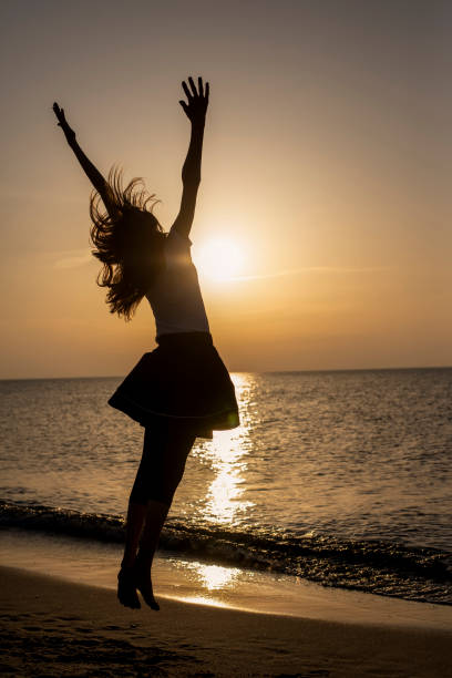 istock young girl cheering with outstretched arms 1198106535