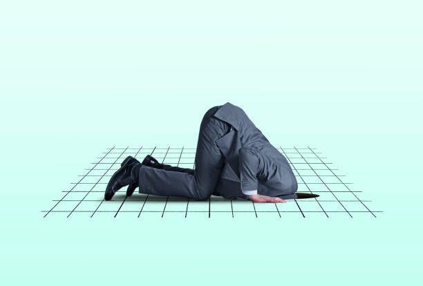 Head In Financial Hole A man kneels on all fours as he places his head into a hole in the ground that is overlayed with a graph representing the financial markets. head in the sand stock pictures, royalty-free photos & images