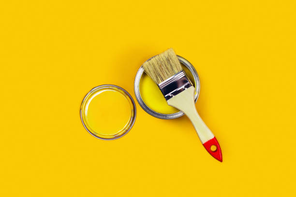 istock Colored background with paint jar and brush. 1198107693