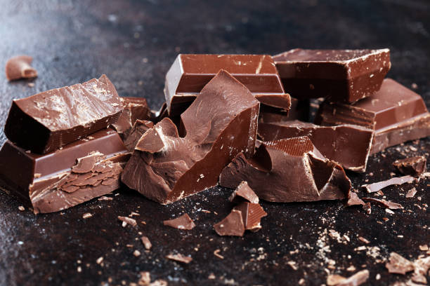 istock Dark chocolate stack, chips and powder with chocolate bars and block 1198110139
