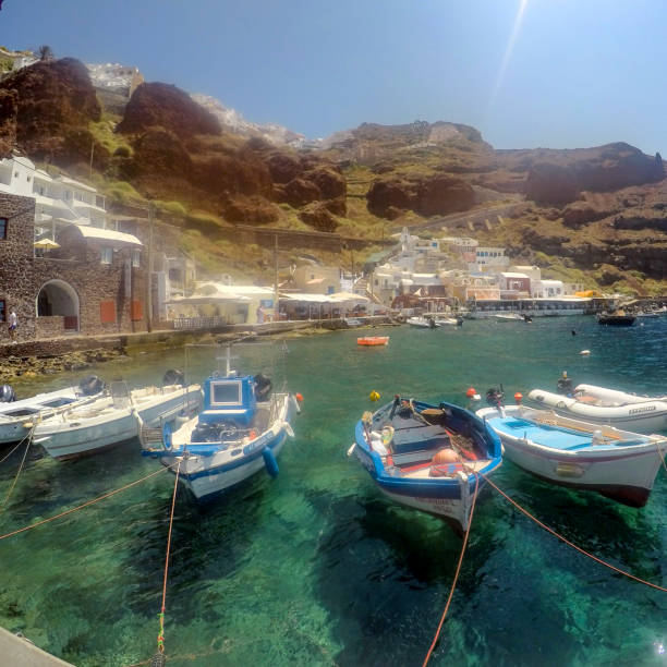 Boats tied up on a sunny day on Amoudi Bay in Santorin