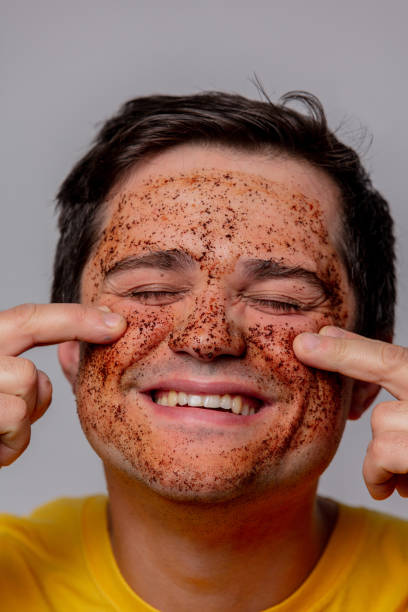 istock beautiful brunette man with coffee beans mask 1198114984