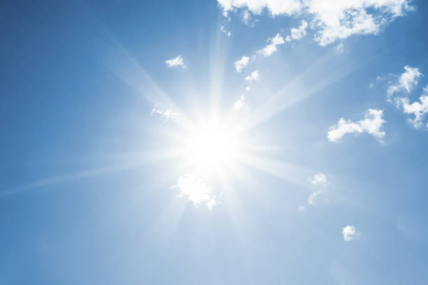 istock Bright sun with beautiful beams in the sky with clouds 1198117237