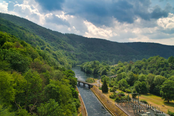 Power line pylons on Edersee wall surrounded by Forest