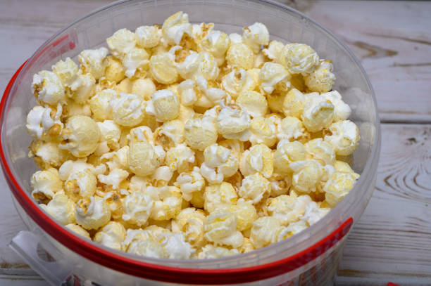 istock Plastic bucket with sweet popcorn ready to eat 1198118873