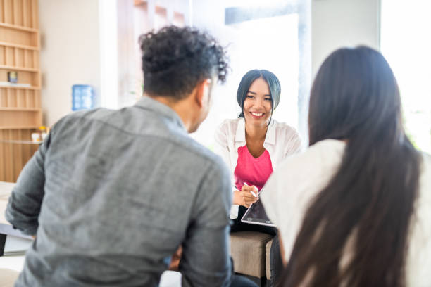 istock Young thai couple talking to doctor 1198119684