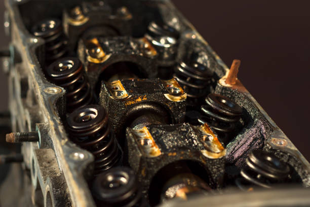 istock Interior of an old worn internal combustion engine. Nagar, black deposits inside the engine, pushers. 1198119774