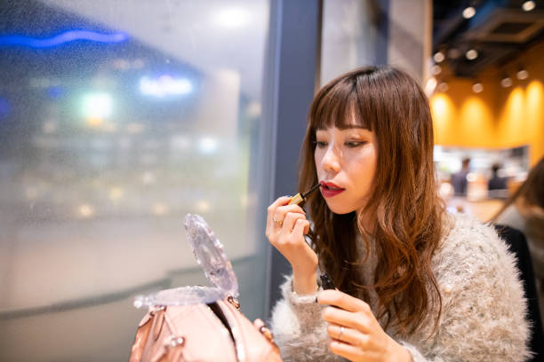 istock Woman making up after dinner in restaurant 1198121674