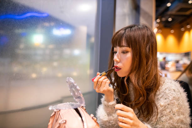 istock Woman making up after dinner in restaurant 1198121705
