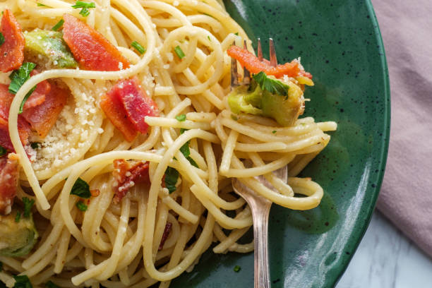 Italian Spaghetti Alla Carbonara Creamy Italian cuisine spaghetti alla carbonara with bacon and brussel sprouts pecorino romano stock pictures, royalty-free photos & images
