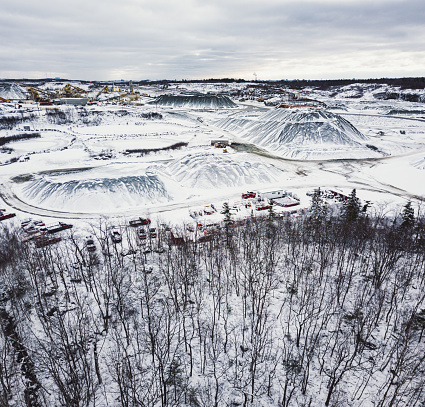 Aerial drone view of a large gravel quarry in Winter.
