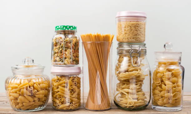 istock pasta in glass jar with white background 1198121919
