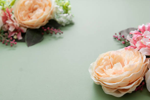 istock Spring feminine background, vintage flower composition on green board. Festive frame or border, copy space. 1198122007