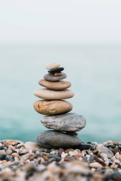 istock Stack of pebble stones on the beach. Spa and spiritual concept 1198122810
