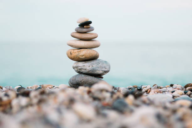 istock Spa and wellness background. Stack of pebble stones on the beach. 1198122811