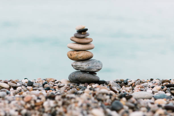 istock Stack of pebble Stones on ocean background. Peaceful and calm concept 1198122820