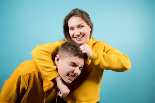 istock sister and brother is playfully fighting 1198124969