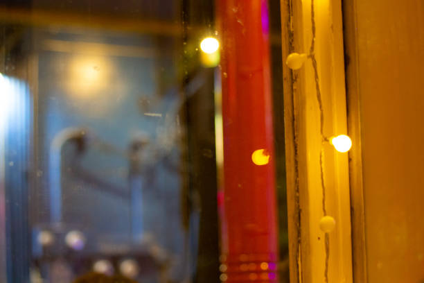 istock Lights in red and yellow window frame 1198128413