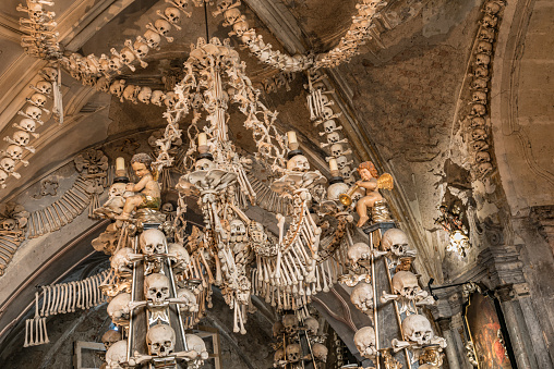 Prague, Czech Republic - Sept 04, 2019: Arranged Human Skulls and Bones in Kostnice Church in Kutna Hora, Czech Republic.
Ossuary decoration of human bones and skulls