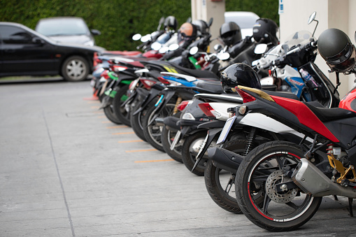Motorcycle parking in line outdoor.