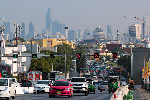 Bangkok, Thailand - December 13, 2019: Traffic jam on Phra Pinklao Bridge over Chao Phraya River in central Bangkok.