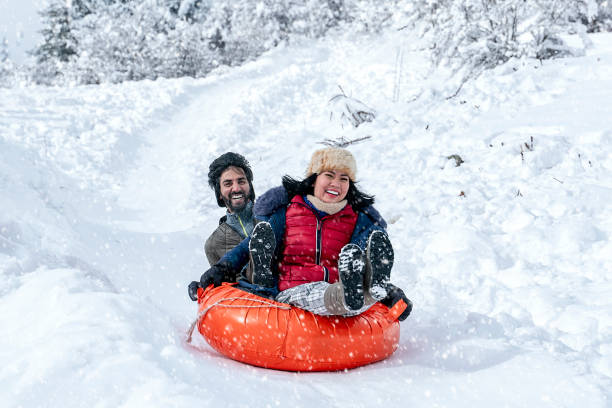istock Sledding tubes on snowy hill in winter 1198138458