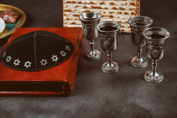 istock Pesah holiday celebration, matza unleavened bread and four cup kosher wine 1198139166