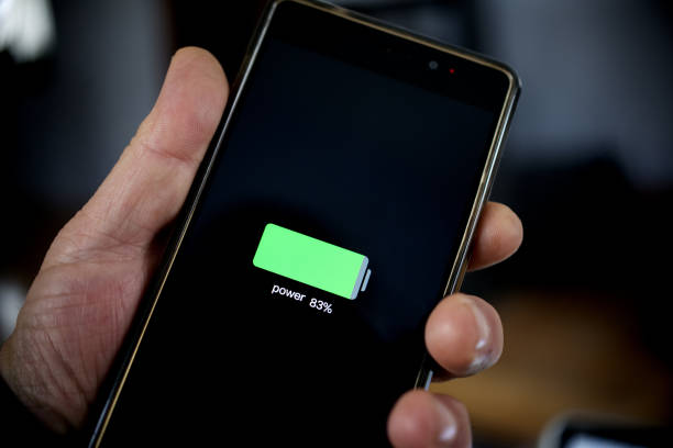 istock hand holding smartphone showing battery level after charge 1198139847
