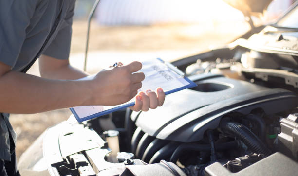 istock Auto repair specialist has checked the engine repair list for both internal and external systems, Car repair service concept. 1198143805