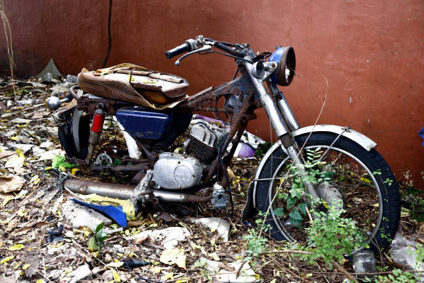 istock Old, broken and rusty motorcycle at an empty lot 1198145670