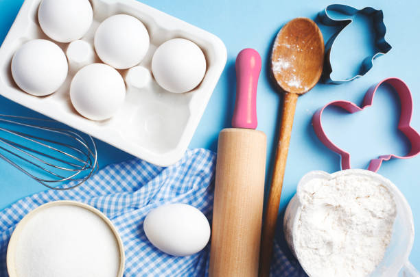 istock Easter baking. Ingredients and kitchen items for baking. Kitchen utensils, flour, eggs, sugar. Top view. 1198150987