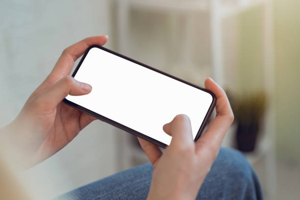 istock Woman hand hold smart phone with blank copy space screen for your advertisement. 1198154756