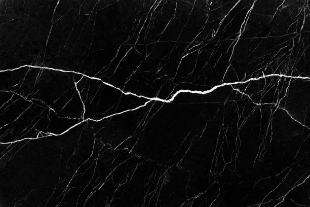 istock Black marble dark texture with white cracked wave patterns abstract for nature background 1198156339