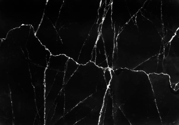 istock Dark black marble texture with white cracked wave patterns abstract for nature background 1198157141