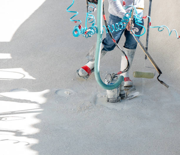 istock Man using a propane torch, roller, and sump pump during a swimming pool renovation 1198157195
