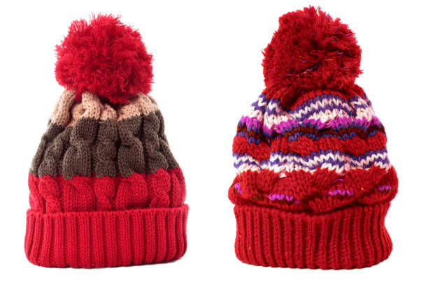 istock Two red winter knit ski hat isolated white 1198158869
